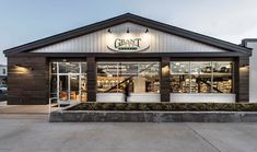 the front of a grocery store with large windows