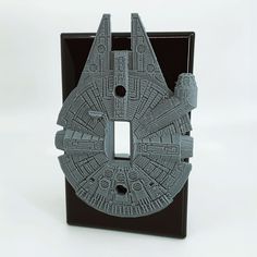 a star wars light switch plate cover is shown in this image, it looks like the millennium