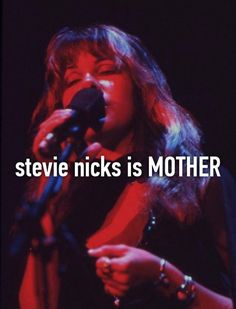 a woman singing into a microphone with the words steve nicks is mother