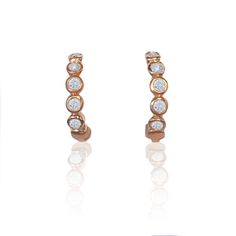 Petite diamond and rose gold huggies. 5 petite diamonds in each earring, 10 diamonds total Measures 5/8" tall 14k rose gold Made to order Rose Gold Vvs Clarity Huggie Diamond Earrings, Rose Gold Hoop Earrings With Single Cut Diamonds, Rose Gold Diamond Hoop Earrings With Single Cut Diamonds, Classic Rose Gold Huggie Earrings With Single Cut Diamonds, Rose Gold Single Cut Diamond Huggie Earrings For Anniversary, Rose Gold Small Hoop Huggie Earrings With Diamond Accents, Rose Gold Small Hoop Diamond Earrings, Gold Huggies, Diamond Huggies