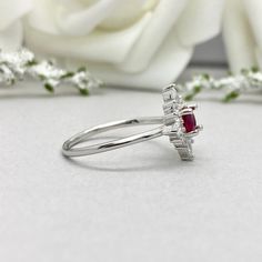 This beautiful ring is made from Solid 14K White Gold Rhodium plating. Ring details- -The Main stone is an oval cut 5mm Lab Pink Ruby -Side stones are 4mm by 2mm clear Marquise and 1.4mm Round simulated diamonds -Ring is casted in Solid 14K White Gold Rhodium plating ( 14K Solid Yellow Gold and 14K Rose Gold also available, please check the drop down menu for more options) -The Total face height of the ring measures 10mms and the band width measures 1.4mms -Each ring is handmade and made to orde White Gold Ruby Ring With Halo For Wedding, Cluster Ruby Ring In White Gold For Wedding, White Gold Cluster Ruby Ring For Wedding, Cluster Birthstone Rings For Weddings, Wedding Cluster Rings With Birthstone, Wedding Cluster Birthstone Rings, Cluster Ruby Ring With Accent Stones For Wedding, Silver-toned Ruby Ring With Halo For Wedding, Marquise Ruby Cluster Ring For Wedding