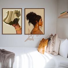 two paintings on the wall above a bed