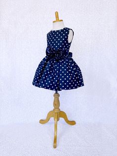 Hand stitched together with the upmost care, this dress is perfect for any occasion: birthdays, pageants, photoshoots, and holiday parties! The comfortably soft polka dot dress is made out of cotton material; The bodice is sleeveless with a zipper in the back. The dress comes with a detachable ribbon sash and mini sequin small bow to add sparkle. Knee length skirt made out of cotton polka dot fabric. Under the skirt is one layer of lining with crinoline attached to add extra puffiness. *Mannequi Sleeveless Princess Dress For Christmas, Sleeveless Christmas Princess Dress, Sleeveless Christmas Dress With Bow, White Sleeveless Princess Dress For Christmas, Princess Style Sleeveless Holiday Dress For Pageants, Princess Style Sleeveless Holiday Dress For Pageant, Pageant Princess Style Sleeveless Holiday Dress, Princess Style Sleeveless Pageant Holiday Dress, Summer Princess Sleeveless Pageant Dress