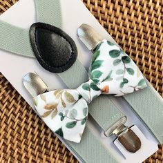 This sage floral green bow tie & sage suspenders set is a great choice for a beach wedding, sage green bowtie for ring bearer outfit, bowties, bow ties for men, boys or women, or any other special occasion. ❤ **Please Specify** Bow Tie Only (w/ Clip or Neck Strap), Suspenders Only, or Bow Tie Only & Susp (Bow Tie and Suspenders) SUSPENDERS- One Pair of our Quality Suspenders BOW TIE - One Bow Tie on White Adjustable STRAP or Alligator CLIP **CLIP ON Bow Ties are Recommended/Suitable for Children Green Bowtie, Mens Bowtie, Bow Ties For Men, Random Products, Ring Boy, Gentlemen Wear, Green Bow Tie, Bearer Outfit, Bowtie And Suspenders