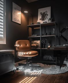 a brown leather chair sitting in front of a wooden desk next to a radiator