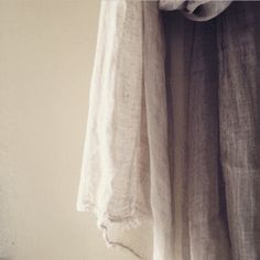 a white shirt hanging from a hook on a wall