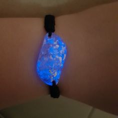 Size: Height  3cm ( 1.18 inch)           Width  1.5cm (0.59 inch) Step into a world of serenity and spiritual elevation with our Celestite Glow-in-the-Dark Orgonite Bracelet. Handcrafted with love and intention, this unique bracelet is not just a piece of jewelry but a powerful talisman that brings luck, healing, and protection. Made with raw celestite, 999 silver leaf, resin, and a durable nylon cord, each bracelet is adjustable to ensure a perfect fit for everyone. Highlights of Your Celestite Magical Handmade Bracelets As A Gift, Luminous Adjustable Bracelets As Gifts, Luminous Spiritual Jewelry As A Gift, Luminous Spiritual Jewelry For Gifts, Spiritual Luminous Jewelry As Gift, Black Luminous Bracelets For Gift, Adjustable Luminous Blue Jewelry, Adjustable Blue Luminous Jewelry, Glow In The Dark Black Jewelry For Gift