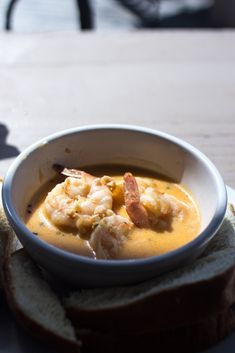 a white bowl filled with food on top of a table