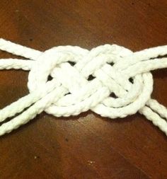 a knot is on top of a wooden table