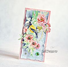 a close up of a small card with flowers on it and a bird in the middle