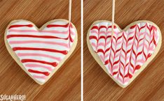 two heart shaped cookies hanging from strings with red and white icing on them, one in the shape of a heart