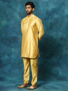 VASTRAMAY Men's Mustard Viscose Kurta Pyjama Set A classic choice for any festive occasion, the VASTRAMAY Men's Mustard Viscose Kurta Pyjama Set exudes elegance and style. Crafted with high-quality viscose fabric, it offers utmost comfort and a perfect fit. Whether it's a wedding ceremony or a cultural festival, this kurta pyjama set is sure to make you stand out. Features: Classic mustard color Soft and breathable viscose fabric Elegant design with intricate detailing Comfortable pyjama with drawstring closure Specifications: Material: Viscose Color: Mustard Sizes Available: S, M, L, XL Occasion: Festive, Wedding, Cultural Events Material & Care: Viscose fabric tends to shrink a bit after the first wash. It is recommended to hand wash or machine wash in cold water with mild detergent. Avo Classic Traditional Wear For Eid Festive, Classic Gold Long Sleeve Sets, Classic Long Sleeve Festive Traditional Wear, Classic Gold Sets For Festive Season, Classic Gold Festive Sets, Classic Gold Festive Set, Classic Eid Festive Sets, Classic Festive Sets For Eid, Formal Yellow Sets For Festivals