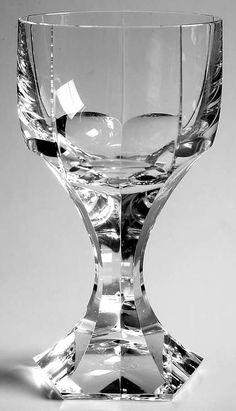 a clear glass vase sitting on top of a table