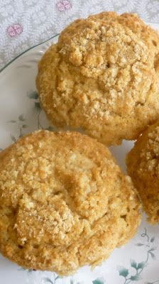 three muffins sitting on top of a white plate