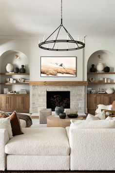 a living room filled with furniture and a fire place