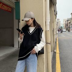 Harajuku Street Style Casual Oversized V-neck Knit Vest (Black/White) SIZE INFO S - Bust 102cm/40.1", Length 60cm/23.6" M - Bust 104cm/40.9", Length 61cm/24.0" L - Bust 106cm/41.7", Length 62cm/24.4" XL - Bust 108cm/42.5", Length 63cm/24.8" NOTE: DUE TO VERY HIGH DEMAND, PLEASE ALLOW 12-20 DAYS FOR DELIVERY TO THE US, AND 20-45 DAYS TO THE REST OF THE WORLD. Harajuku Street Style, Outfit Korean Style, Women Vest, Grunge Look, Vintage Vest, Casual Vest, Trik Fotografi, Vest Fashion, Vest Outfits