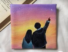 a painting of two people pointing at the sky with an open book in the background