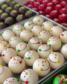 there are many decorated cookies in the tray