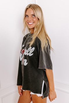 - Sparkle on the sidelines with this adorable 'FOOTBALL MOM' top! Perfect for showing your team spirit, this piece is comfy-casual style with a touch of glam. Its eye-catching design makes it a must-have for every proud football mom. - Unlined sweatshirt material with a vintage wash - A white and red hued 'FOOTBALL MOM' graphic design with rhinestone accents - Unfinished seam accents - A crew cut neckline - Short, loose sleeves - An ultra-relaxed silhouette that ends in a high-low hemline with s Crew Cut, Loose Sleeves, Crew Cuts, Embellished Top, Football Mom, Distressed Shorts, White And Red, Comfy Casual, Team Spirit