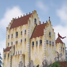 a very large building with some windows on it's sides and a red roof