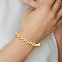 Dynamic textured links entwine with striking high-polish links in this distinctive women's bracelet. Fashioned in 14K yellow gold, the 7.5-inch chain secures in place with a lobster clasp. Twisted Bangle, Gold Link Bracelet, Yellow Gold Bangle, Gold Link Chain, Link Chain Bracelet, Bracelet Clasps, Hinged Bangle, Gold Polish, Gold Bangles