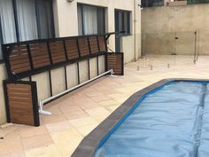 an empty swimming pool in front of a building