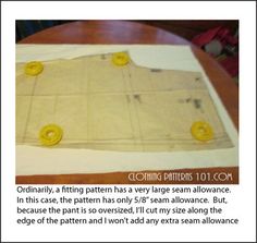 the sewing pattern is being made on top of a piece of paper with yellow buttons