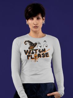 a woman wearing a long sleeved shirt with the words watch please printed on it