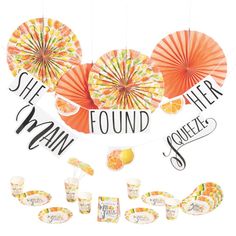 an assortment of oranges and umbrellas hanging from strings with the words, safe to drink, found by many people