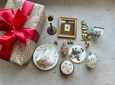 a table topped with lots of plates and gifts