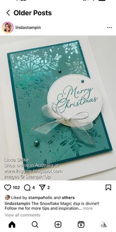 an old postcard has been placed on top of a card that says merry christmas