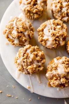 a white plate topped with cookies covered in icing