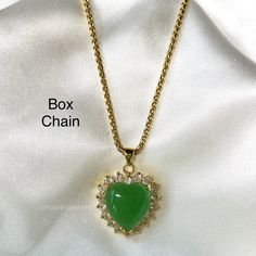 DESCRIPTION: Besides symbolizing renewal, protection and prosperity, the Jade stone is also known for reviving passions, uplifting spirits and turning a few heads. All major wins. Styling with a pop of color is effortless with our 18K Gold Plated Jade Heart Necklace. MATERIAL: 18K Gold Plated over Stainless Steel. Cubic Zirconia. Hypoallergenic, Tarnish Free and Water Resistant. LENGTH: Multiple chain options and sizes available for selection above. Pendant size: 1 inch Mix and match with any of Heart Initial Necklace, Customized Necklace, Gift For Him Birthday, Figaro Necklace, 18k Gold Necklace, Figaro Chains, Necklace Box, Jade Stone, Box Chain