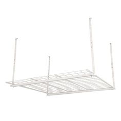 a white metal shelf with two poles attached to it