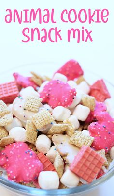 an animal cookie snack mix in a bowl with pink and white marshmallows