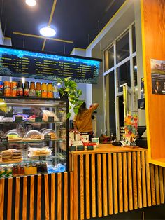 a person standing in front of a counter filled with food