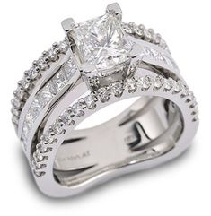 a white gold ring set with princess cut diamonds