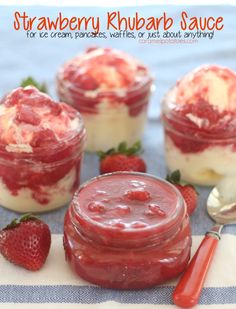 strawberry rhubarb sauce in jars with strawberries