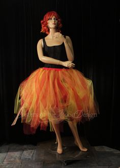 "The perfect tulle skirt for halloween or to wear all Autumn! Makes a great phoenix fire tutu for an adults halloween costume. Made in XS to Plus size This tutu skirt is handmade from 100yards of 6\" strips of tulle in Red, orange, golden yellow and copper glimmer Bridal tulle. All tulle is then tightly machine gathered, sewn and sergered to the red fabric covered elastic waistband. This tutu is fully sewn, it is not tied tulle. Tutu skirt is made to be around tea / calf length. Can be ordered f Phoenix Fire, Tulle Tutu, Adult Halloween Costumes, Costume Cosplay, Tutu Skirt, Tea Length, Red Fabric, Golden Yellow, Fabric Covered