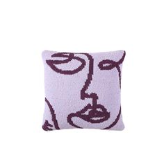 a purple and white pillow with an image of a woman's face on it