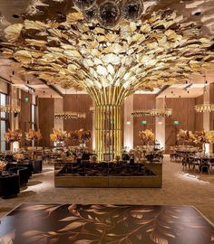 an elegantly decorated lobby with chandeliers and tables