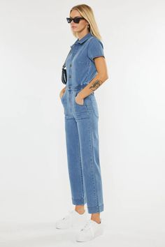 Turn heads everywhere you go in this stylish denim jumpsuit! You are sure to become an instant fashionista with this trendy-chic jumpsuit with a straight-leg fit in a medium wash. Kancan Straight Leg Jumpsuit Elastic Waistband 4 Pocket Design Exposed Button-up Front Rise 11.75" Inseam 26.5" (size M) Color - Medium Wash Blue Denim 77% Cotton 10% Polyester 5% Rayon 6% T-400 2% Spandex Casual Denim Jumpsuit For Workwear, Chic Medium Wash Jumpsuits And Rompers With Pockets, Trendy Relaxed Fit Medium Wash Denim Jumpsuit, Casual Denim Overall Jumpsuit For Work, Casual Denim Blue Jumpsuits And Rompers For Work, Casual Light Wash Wide Leg Jumpsuits And Rompers, Chic Denim Blue Relaxed Fit Jumpsuit, Casual Light Wash Wide-leg Jumpsuits And Rompers, Light Wash Relaxed Fit Jumpsuit For Workwear