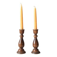 two wooden candles sitting next to each other