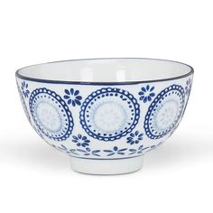 a blue and white bowl sitting on top of a table