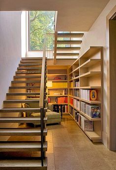 an instagram page with stairs and bookshelves