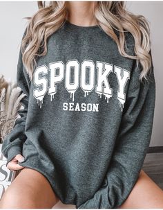 Get into the Halloween spirit with our "Melted Spooky Sweater"! This cozy and stylish sweater features a unique design where the word "Spooky" appears to be melting, adding a touch of eerie elegance to your fall wardrobe. Perfect for chilly nights and haunted gatherings, this sweater is a must-have for anyone looking to embrace the spooky season with a twist. Stay warm and spooky in the most fashionable way! Dancer Shirt, Ghost Dog, Halloween Nurse, Dog Sweatshirt, Stylish Sweaters, Halloween School, Dog Halloween, Halloween Sweatshirt