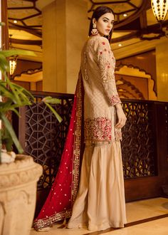 Designer embroidered outfit in skin color with red dupatta for party wear. Fast delivery in USA is available for Pakistani designer embroidered outfit Embroidered Outfit, Red Dupatta, Kameez Designs, Resham Work, Cotton Salwar Kameez, Skin Colour, Silk Trousers, Wedding Function, Salwar Kameez Designs