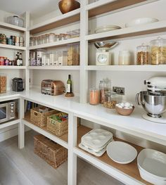 a kitchen with lots of shelves filled with food