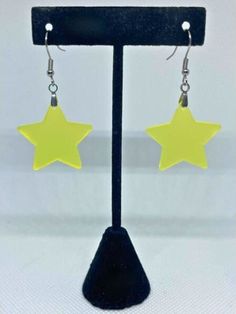 These beautiful frosted yellow star earrings are the perfect accessory to add a pop of color to your jewelry collection. The subtle yellow hue adds a touch of whimsy and charm to any outfit. These earrings come with hypoallergenic stainless steel hooks, making them perfect for those with sensitive ears. The hooks are easy to insert and remove, and the earrings are lightweight and comfortable to wear throughout the day.  Can be made on your choice of either silver, gold, rose gold or black stainless steel ear hooks OR silver, gold, or black stainless steel kidney wire. Cheap Multicolor Star Earrings, Yellow Gold Drop Earrings With Star Charm, Multicolor Star Earrings, Yellow Gold Star-shaped Pierced Earrings, Yellow Star Earrings, Ombre Earrings, Stacked Pumpkins, Crochet Stars, Glitter Ombre