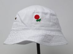 Item: rose embroidered bucket hat Material: 100% cotton Size: one size fits most Embroidery: hand made with acrylic thread Free first class shipping, upgradable priority mail service. 30 days return policy, feel confident at your purchase! Cheap Summer Hats With Embroidery, Brown Bucket Hat, Embroidered Bucket Hat, Boonie Hat, Cotton Bucket Hat, Embroidery Hand, Sun Cap, Single Rose, Fish Camp